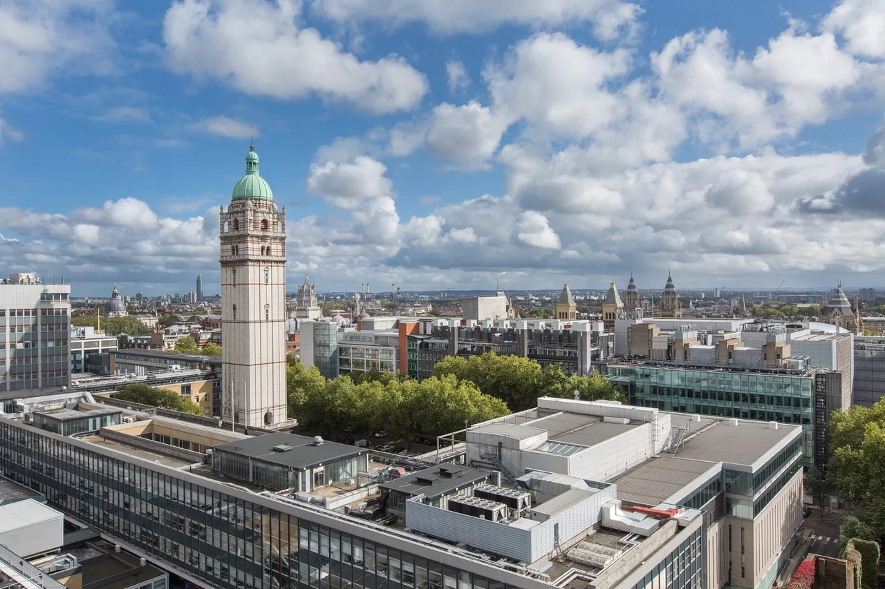 The Queen’s Tower and the Imperial College London campus in South Kensington, under a blue sky